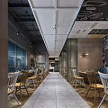 Modern Restaurant Interior With Open Layout Wooden Tables Chairs Pendant Lights And Glass Windows