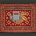 Household Items Arranged On Red Floral Pattern Carpet With Small Boxes And Dice