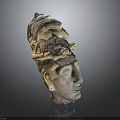 Man Head Sculpture Featuring Intricate Bird Ornament and Artistic Carved Details