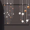 Elegant Modern Chandelier With Hanging Glass And Metallic Spheres For Decorative Lighting