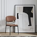 Brown Leisure Chair with Black Frame Stack of Books beside Abstract Painting on White Wall