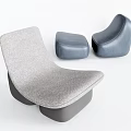 Stylish Gray Upholstered Single Sofa With Navy Blue Ottomans In Modern Living Room