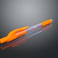 Orange Pen With Orange Grip Transparent Barrel And White Tip On Black Surface With Reflection