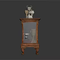 Wooden Display Cabinet with Glass Door Trophies on Top and One Trophy Fallen on Floor