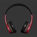 Modern Headphones with Black Headband and Red Black Ear Cups on Black Reflective Surface