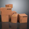 Household Items Packed in Multiple Stacked Cardboard Boxes With Fragile Labels