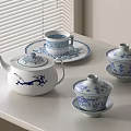 Traditional Blue and White Tea Set with Teapot Cups and Saucers on Tabletop