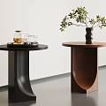 Modern Side Tables With Round Tops Curved Bases Glass Jar Teacups Tray Vase And Plant
