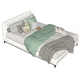 Cozy Single Bed with White Headboard Green Quilt Gray Blanket Pillows and Stuffed Toy