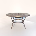 Outdoor Metal Circular Table With Decorative Pattern And Ornate Iron Base For Garden Patio Use