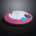 Pink And White Circular Device With Antenna Blue And Yellow Elements On Top