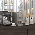 Modern Coffee Makers As Kitchen Appliances With Cups And Bean Bags On Wooden Counter