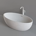 Modern White Oval Freestanding Bathtub With Chrome Faucet In Bathroom
