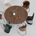 Round Wooden Dining Table Set With Assorted Color Chairs And Decorative Vase Plants