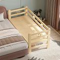 Wooden Toddler Bed With Safety Rail Attached to Adult Bed And Soft Rug And Stuffed Reindeer Toy