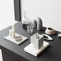 Modern Black Tabletop Display With Decorative Objects And Office Supplies