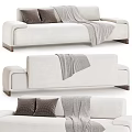Modern Beige and Purple Three-Seater Sofa with Gray Pillows and Cozy Blanket
