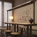 Wooden Dining Table with Stools Minimalist Wall Hanging Rack Floor Lamp Vase and Red Blossoms