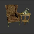 Brown Tufted Armchair With Wooden Legs And Small Round Table Featuring Teapot Teacup