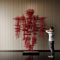 Red Linear Sculpture Abstract Human Figure Form In Modern Interior Space With Person Appreciating