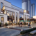 Modern Commercial Street Featuring Pedestrians Outdoor Seating Green Plants and Street Lamps