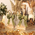 Elegant White Gift Bags With Gold Glitter Bows In Decorative Setting and Floral Arrangements