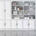 Modern White Decorative Cabinet With Gold Handles And Open Shelves For Decorative Items