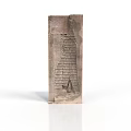 Ancient Stone Tablet Sculpture With Carved Hieroglyphs And Intricate Patterns