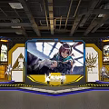 Gaming Character Display Area With Large Screen Figurine Cases Industrial Ceiling Pipes And Kamon Logo