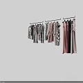 Various Styles Clothes Hanging On Hangers With Different Colors And Fashion Designs