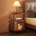 Wooden Bedside Table With Table Lamp Photo Frame Books And Rattan Basket Next To Bed