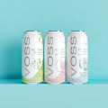 VOSS Flavored Beverage Cans With Three Different Fruit Flavors On Light Blue Background