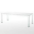 Transparent Glass Dining Table With Four Slim Legs And Modern Minimalist Design