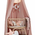 Wicker Baby Crib With Pink Canopy Cloud And Star Decorations And Soft Blanket