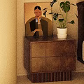 Brown Wooden Bedside Table With Drawers Potted Plant And Wall Artwork Near Bed