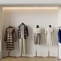 Mannequins Showcase Various Fashion Styles Including Dresses Coats Shirts In Light Wall Clothing Display Area