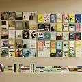 Colorful Books And Magazines Display Various Covers Stacked On Home Library Wall