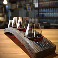 Wooden Arc Shaped Decorative Set With Transparent Glass Cups And Red Wine On Tabletop