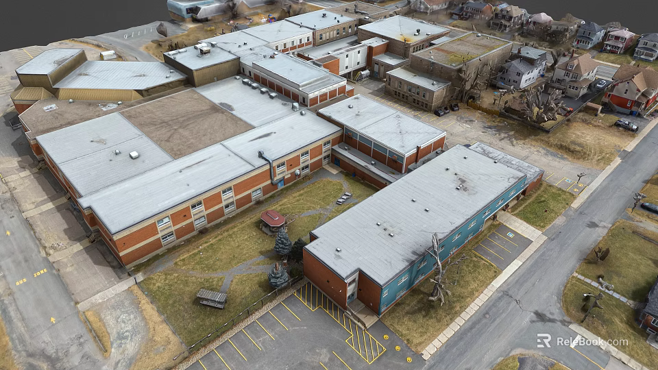 Aerial View Of Multiple Brick And Metal Buildings With Gray Roofs And Parking Lot 3d model 