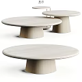 Three Light Colored Wooden Round Coffee Tables With Pedestal Base And Minimalist Design
