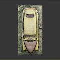 Weathered Yellow Car Model with Rust and Damaged Parts on Green Base