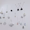 Various Modern Pendant Lights With Different Contemporary Designs Displayed On Wall 3d model