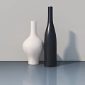 Modern White And Black Vases On Blue Countertop With Light Background Wall