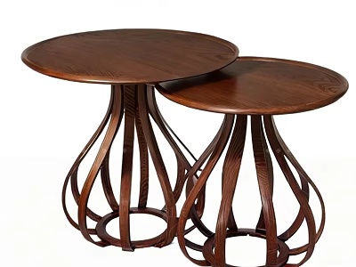 Two Round Wooden Coffee Tables With Intricate Curved Base Design 3d model