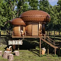 Wooden House in Forest with Mushroom Shaped Roof Wooden Platform and Squirrel Elements