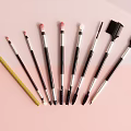 Professional Makeup Brushes With Various Colors And Sleek Handles On Pastel Background