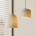 Two Beige Dome Shaped Felt Pendant Lights With Soft Lighting Near Window Blinds