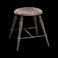 Rustic Wooden Stool With Round Seat And Four Carved Legs Design