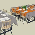 Dining Table Set Featuring Gray Orange Tablecloths Wooden Chairs Tableware And Potted Plants