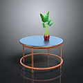 Round Modern Coffee Table With Blue Tabletop Copper Legs And Red Vase With Green Leaves